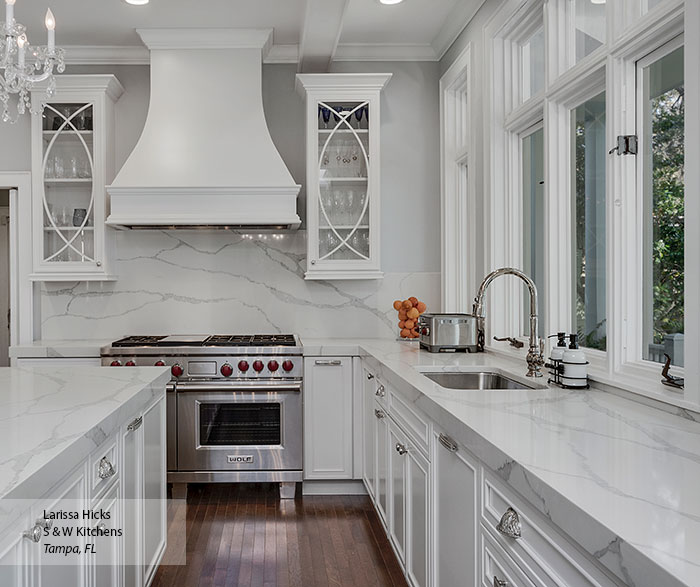 Classic natural oak kitchen cabinetry showing visible wood grain and framed door construction